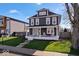 Inviting two-story house featuring a classic design and a cozy front porch with seating at 549 Keystone Ave, Indianapolis, IN 46201