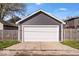 View of a detached garage with a white garage door at 549 Keystone Ave, Indianapolis, IN 46201
