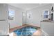 Bright laundry room featuring a stackable washer and dryer and a sink at 549 Keystone Ave, Indianapolis, IN 46201