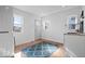 Bright laundry room featuring a stackable washer and dryer and a sink at 549 Keystone Ave, Indianapolis, IN 46201