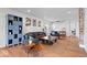 Open-concept living room with an exposed brick accent wall and stylish decor at 549 Keystone Ave, Indianapolis, IN 46201