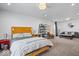 Spacious main bedroom features neutral walls, a wood bed frame, and cozy sitting area at 549 Keystone Ave, Indianapolis, IN 46201