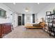 Well-lit main bedroom featuring decorative Indiana wall hanging, wood floors, and plenty of space at 549 Keystone Ave, Indianapolis, IN 46201