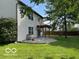 Expansive backyard with lush lawn, a pergola-covered patio, and mature shade trees at 563 Jet Stream Blvd, Westfield, IN 46074