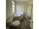 Relaxing bathroom featuring a soaking tub with a shower and tiled vinyl flooring at 563 Jet Stream Blvd, Westfield, IN 46074