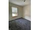 Well-lit bedroom with carpet, window, and fresh, neutral-colored walls and ceilings at 563 Jet Stream Blvd, Westfield, IN 46074