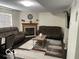 Cozy living room featuring a fireplace, plush couches, a decorative rug, and modern decor, perfect for relaxing at 563 Jet Stream Blvd, Westfield, IN 46074