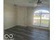 Bright living room with a large window allowing natural light to flood the space, highlighting modern flooring at 563 Jet Stream Blvd, Westfield, IN 46074