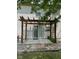 Back patio with a pergola, a stone walkway, and sliding glass doors leading to the home interior, perfect for outdoor enjoyment at 563 Jet Stream Blvd, Westfield, IN 46074