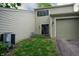 Exterior backyard view of unit, showing a bench, A/C unit, and back door at 5713 Bradston Way, Indianapolis, IN 46237