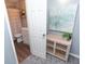 Bathroom view including new vanity, painting, and peek at shower and toilet at 5713 Bradston Way, Indianapolis, IN 46237