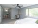 Bright bedroom featuring a ceiling fan, neutral walls, and carpet at 5713 Bradston Way, Indianapolis, IN 46237