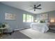Bright bedroom featuring a ceiling fan, neutral walls, and carpet at 5713 Bradston Way, Indianapolis, IN 46237