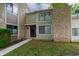 Charming condo with stone accents and a well-manicured lawn at 5713 Bradston Way, Indianapolis, IN 46237