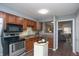 Well-equipped kitchen with stainless steel appliances and wooden cabinets at 5713 Bradston Way, Indianapolis, IN 46237