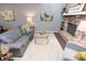 Cozy living room featuring a stone fireplace and modern furnishings at 5713 Bradston Way, Indianapolis, IN 46237
