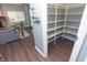 Spacious pantry off of living room with built-in shelving at 5713 Bradston Way, Indianapolis, IN 46237