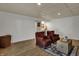 Finished basement featuring shiplap walls, recessed lighting, and stylish seating area at 601 Ridge Rd, Greenwood, IN 46142