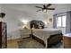 Comfortable bedroom with a large upholstered bed, classic accents, and a neutral color scheme at 601 Ridge Rd, Greenwood, IN 46142