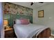 Charming bedroom with unique floral wallpaper feature and natural light at 601 Ridge Rd, Greenwood, IN 46142