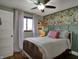 Charming bedroom with unique floral wallpaper feature and natural light at 601 Ridge Rd, Greenwood, IN 46142