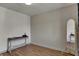 Bedroom featuring a decorative table, a full length mirror, and paneled accent wall at 601 Ridge Rd, Greenwood, IN 46142
