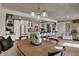 The dining room is open to the kitchen, features a dining table, and offers great natural light at 601 Ridge Rd, Greenwood, IN 46142