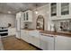 Bright kitchen featuring butcher block countertops, a farmhouse sink, and updated white cabinets at 601 Ridge Rd, Greenwood, IN 46142