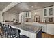 Bright kitchen featuring butcher block countertops, a farmhouse sink, and a large granite island at 601 Ridge Rd, Greenwood, IN 46142