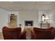 Inviting living room with brick fireplace, hardwood floors, and tasteful furnishings at 601 Ridge Rd, Greenwood, IN 46142