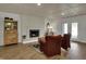 Inviting living room with brick fireplace, hardwood floors, and tasteful furnishings at 601 Ridge Rd, Greenwood, IN 46142