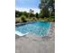Sparkling in-ground pool with a concrete surround, perfect for summer fun and relaxation in the backyard at 601 Ridge Rd, Greenwood, IN 46142