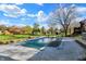 Large covered pool with concrete surround and gravel perimeter, all encompassed by a spacious grassy lawn at 601 Ridge Rd, Greenwood, IN 46142