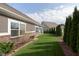 Well-maintained backyard with lush lawn, mature trees, and privacy fence at 6156 N Cedarwood Dr, McCordsville, IN 46055