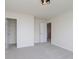 Bedroom featuring neutral carpet, modern light and closet; a bright and modern space at 6156 N Cedarwood Dr, McCordsville, IN 46055