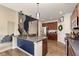 Open kitchen featuring dark wood cabinets and a view of the staircase at 6156 N Cedarwood Dr, McCordsville, IN 46055