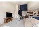 Open living room with high ceilings, plush carpet, and modern furnishings with easy access to kitchen and entry at 6156 N Cedarwood Dr, McCordsville, IN 46055