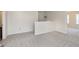 Open loft area with neutral carpet, light fixture, and easy access to multiple rooms at 6156 N Cedarwood Dr, McCordsville, IN 46055