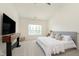 Comfortable main bedroom features vaulted ceiling, TV console, and bright window at 6156 N Cedarwood Dr, McCordsville, IN 46055
