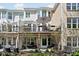 Exterior view of home showing back deck, lower patio, and yard at 675 Greenford N Trl, Carmel, IN 46032