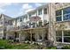 Exterior view of home showing back decks, lower patios, and yard at 675 Greenford N Trl, Carmel, IN 46032