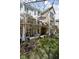 Exterior view of home showing back decks, lower patios, and yard at 675 Greenford N Trl, Carmel, IN 46032