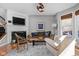 Inviting living room featuring a fireplace, hardwood floors, and comfortable seating at 675 Greenford N Trl, Carmel, IN 46032