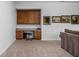 Home office nook with upper and lower cabinets, a desk, and carpet floors at 675 Greenford N Trl, Carmel, IN 46032