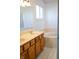 Bathroom featuring a double vanity, soaking tub, and tile flooring at 6967 Bluffridge Way, Indianapolis, IN 46278