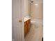 Bathroom features light wood vanity, toilet, and tub with beige tile at 6967 Bluffridge Way, Indianapolis, IN 46278