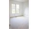 A light-filled bedroom features a window, outlets and light neutral carpet at 6967 Bluffridge Way, Indianapolis, IN 46278