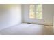 Bright bedroom with a large window and neutral carpet at 6967 Bluffridge Way, Indianapolis, IN 46278