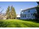 Rear exterior featuring an ample lawn at 6967 Bluffridge Way, Indianapolis, IN 46278