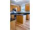 Charming kitchen with wood cabinets, granite countertops, stainless steel appliances, and a functional island at 6967 Bluffridge Way, Indianapolis, IN 46278